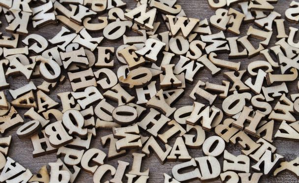 Wooden letters on wooden background. english alphabet - Photo, Image