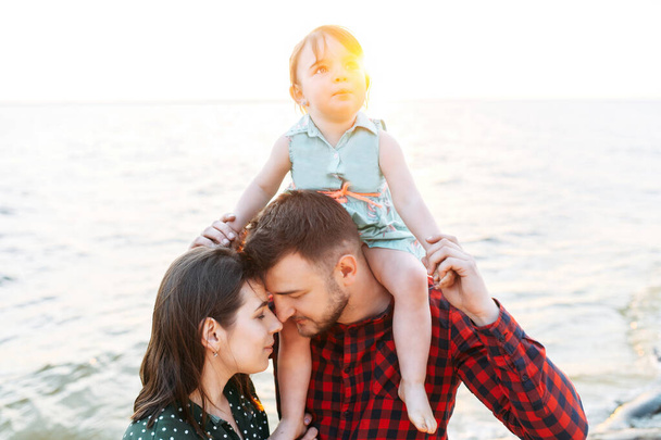 young mother and father with their cute daughter - Photo, Image