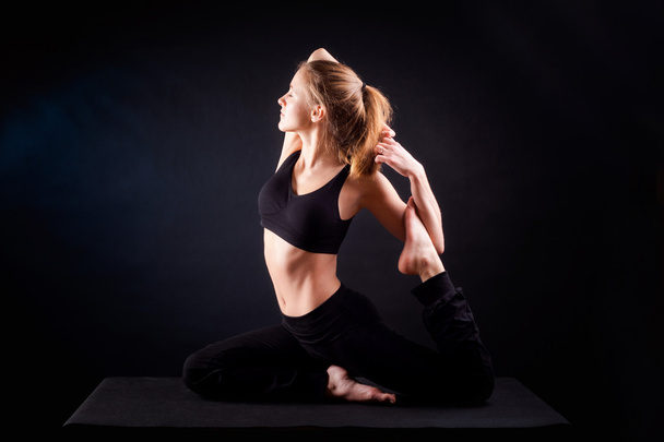 Yoga pose in studio - Photo, Image