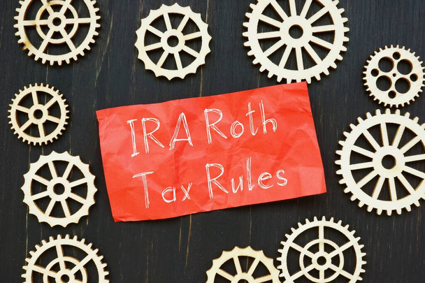 Conceptual photo about IRA Roth Tax Rules with handwritten text. - Photo, Image