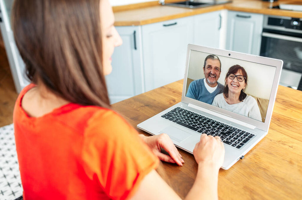 Video call. Woman talks online with her parents - Zdjęcie, obraz
