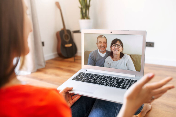 Video call. Woman talks online with her parents - Zdjęcie, obraz