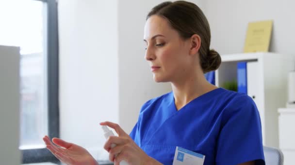 doctor or nurse using hand sanitizer at hospital - Кадры, видео