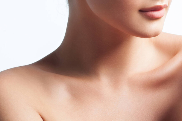Clavicle, neck and lips of young woman close-up. Beauty and skin care. Cosmetology and plastic surgery - Photo, Image
