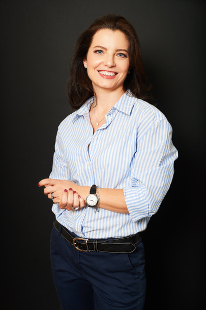 Studio business portrait of beautiful mature woman wearing blue stripe shirt - Photo, Image