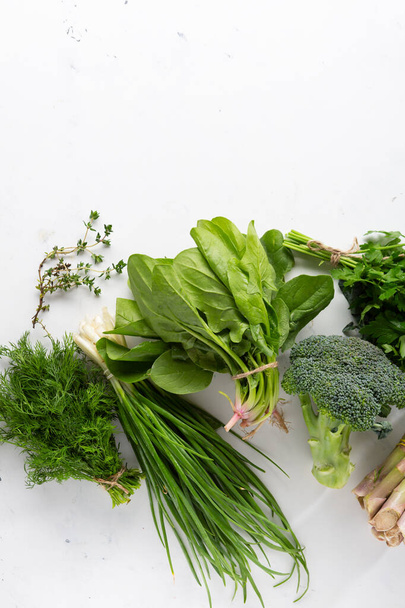 Bunches of fresh green herbs and veggies - Photo, image