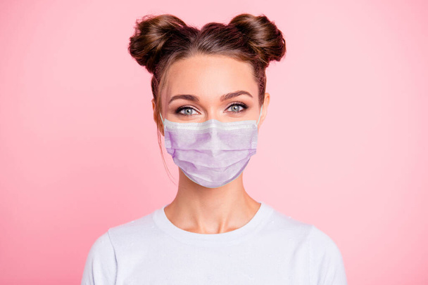 Close-up portrait of her she nice attractive lovable cute adorable winsome girl with two buns wear white shirt protection flu cold facial mask isolated over pink pastel background - Фото, изображение