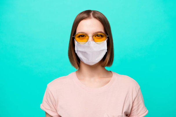 Close up photo beautiful her she lady modern fashionable look short straight hair sincere brown pretty eyes wear specs casual t-shirt flu mask isolated teal turquoise background - Foto, immagini