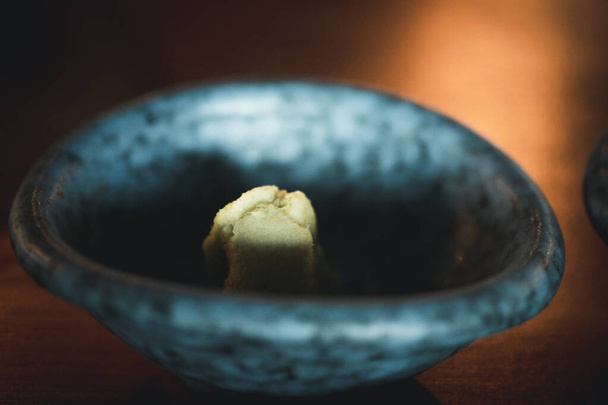 Fresh wasabi in bowl ready to serve on table - Photo, Image