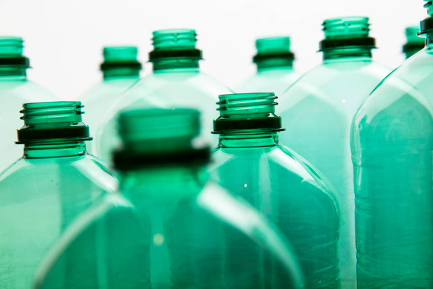 Close up of green plastic water bottles. Household recycling - Foto, Bild