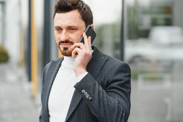 Confident executive manager having mobile talk concentrated on communication - Foto, Imagem