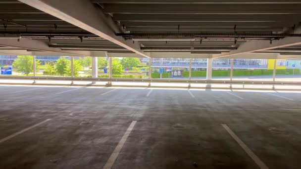 empty parking garage with view on bright surroundings - Footage, Video