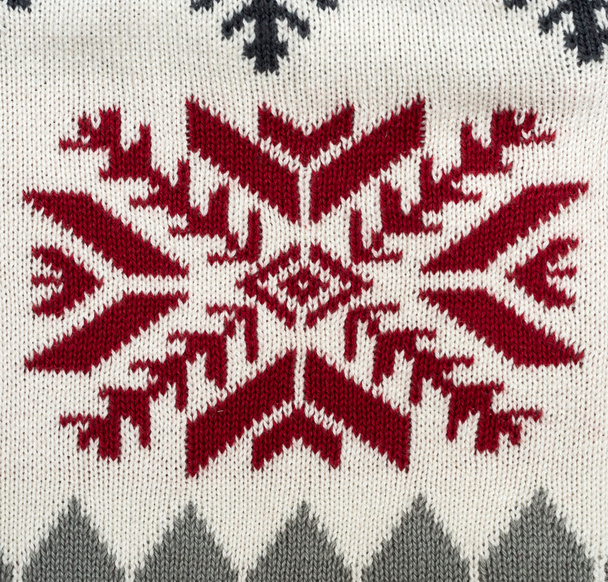 Knitted background with Christmas ornament - Photo, Image