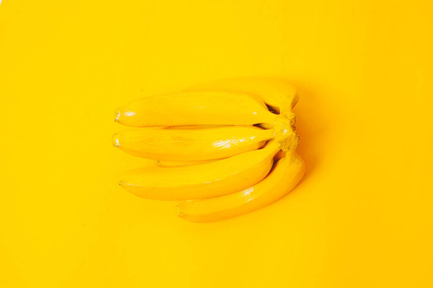bright yellow banana on a yellow background top view - Photo, Image