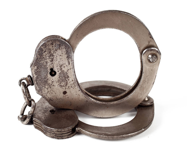 police handcuffs on a white background, isolate, close-up - Foto, Imagen
