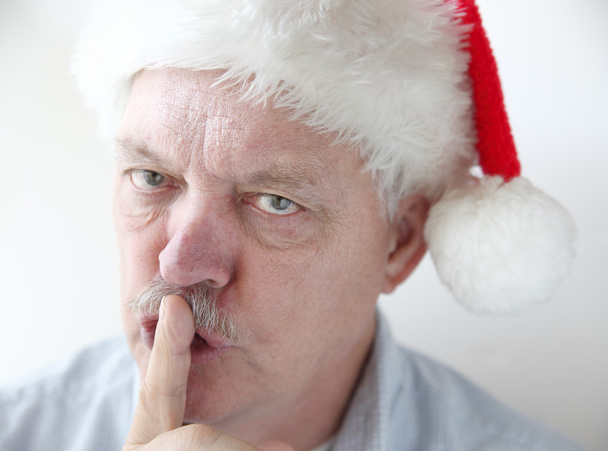 Man in Santa hat asks for quiet - Photo, Image