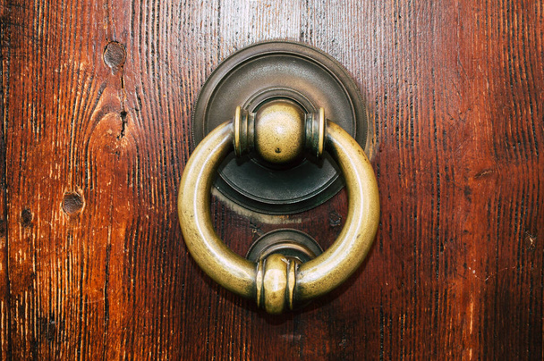 Old iron ring on the door for knocking close up - Photo, Image