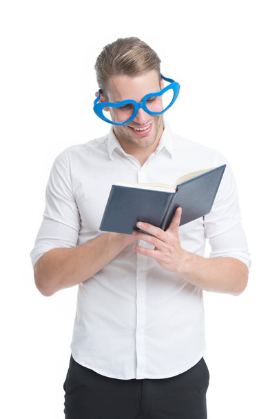 In love with poetry. University student with book. Romantic author. Teacher funny guy. Male student reading. Book nerd wearing cute glasses. Man with book. Study hard. Bookworm and library concept - Foto, Bild