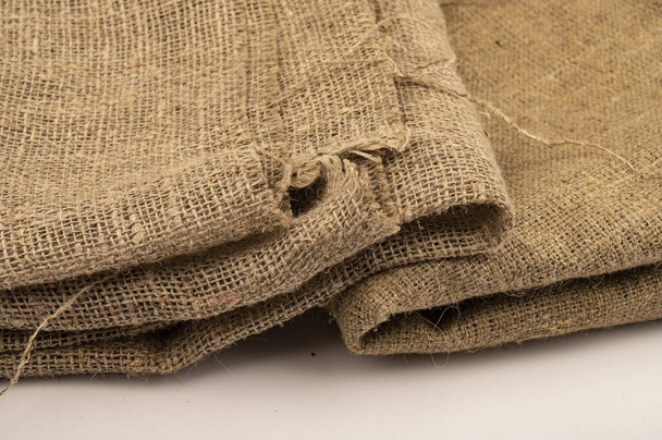 A few pieces of burlap. Fabric with a rough texture for sewing bags. surface texture Close-up - Photo, Image