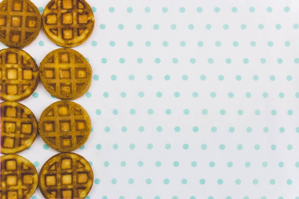 baked round waffles on a white turquoise background copy space - Φωτογραφία, εικόνα