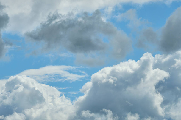 White and thunderclouds in the blue sky. Close up. - Photo, Image