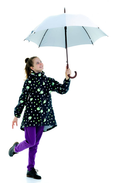 Cute little girl with umbrella. Weather forecast concept. - Fotó, kép