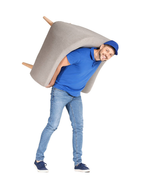 Loader carrying furniture against white background - Fotó, kép