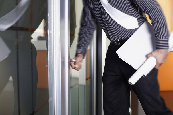 Businessman holding file and document entering conference room - Fotoğraf, Görsel