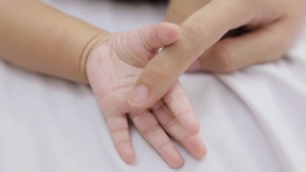 mother and baby holding hand - Footage, Video