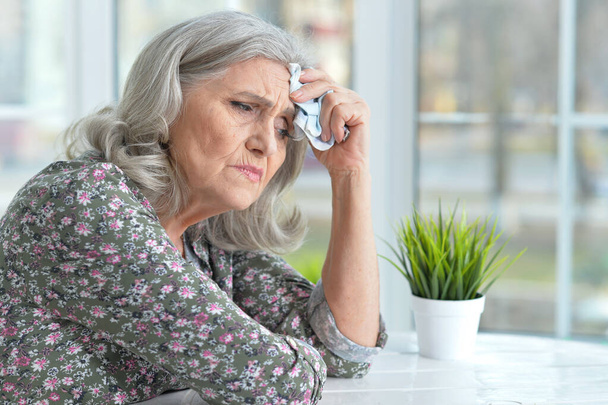 Close up portrait of sad senior woman with headache  - Fotoğraf, Görsel