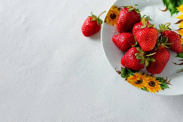 Fresh red aromatic wholesome summer berry. Strawberry. The concept of a healthy diet and agriculture. - Foto, imagen