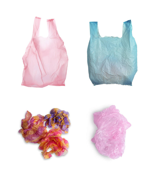 Set of disposable plastic bags on white background. Waste management and recycling - Photo, Image