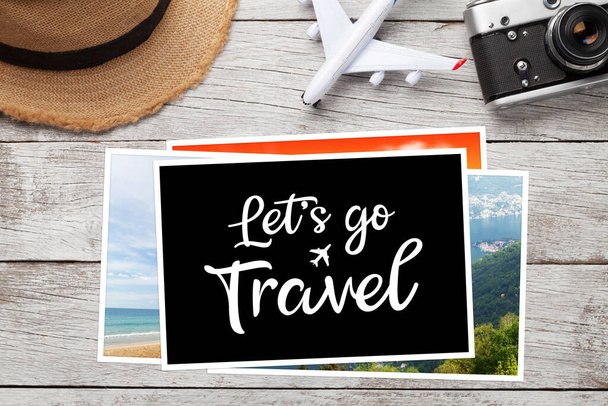 Travel concept with vacation photos, airplane toy, camera and sun hat on wooden table. Top view flat lay with copy space - Fotó, kép
