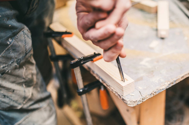Carpentry workshop - professional and qualified woodworking and crafting- work with chisel - Valokuva, kuva