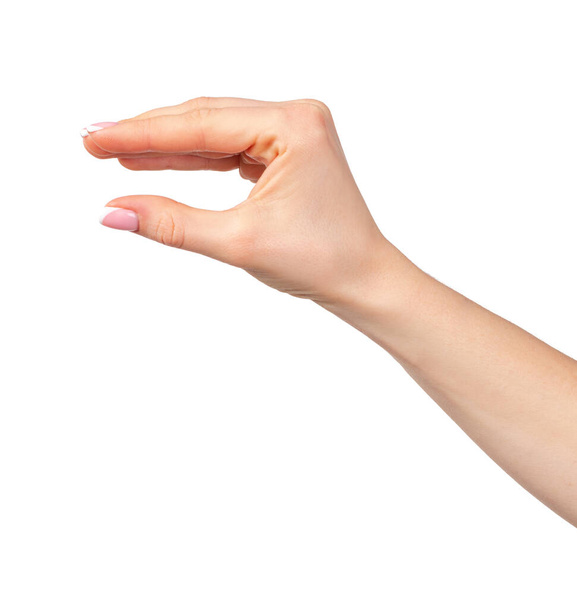 Weibliche Hand hält etwas Isoliertes auf weißem Hintergrund - Foto, Bild