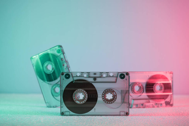 Beautiful Audio cassette tape in neon  light.Minimalism retro style concept. 80s. Background pattern for design. - Фото, зображення