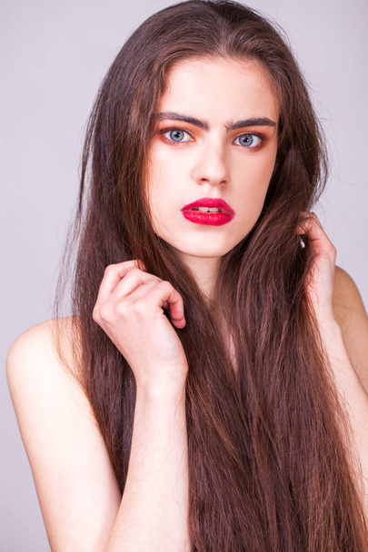 Make up beauty female face. Close up portrait of a young beautiful brunette model in studio - Foto, afbeelding