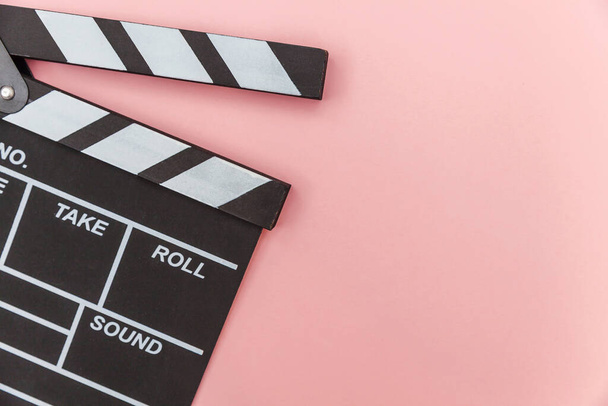 Filmmaker profession. Classic director empty film making clapperboard or movie slate isolated on pink background. Video production film cinema industry concept. Flat lay top view copy space mock up - Φωτογραφία, εικόνα
