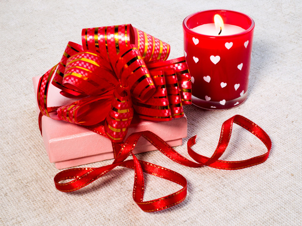 gift and burning candle - Foto, Bild