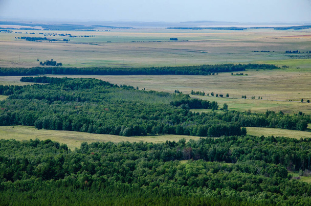 aerial view of the green hills and the forest - Valokuva, kuva