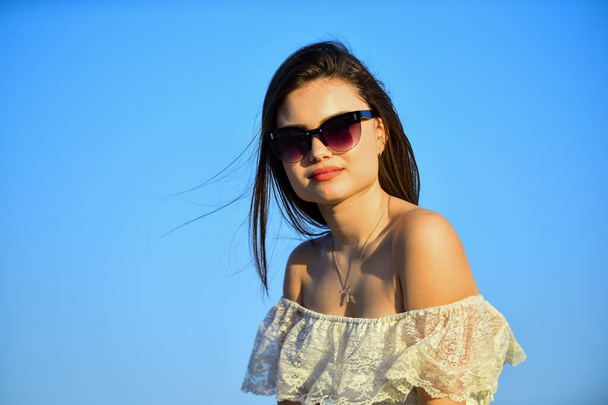 Harmony and balance. Female psychology. Beautiful woman on sunny day blue sky. Female power. Summer fashion. Find inner strength. Girl in sunglasses copy space. Freedom. Carve out time for yourself - Foto, imagen