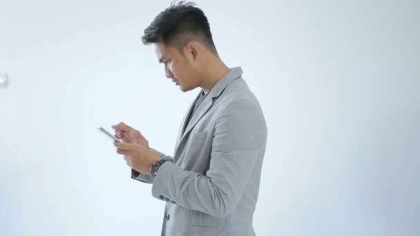 Asian Young Business with smart cell phone - Záběry, video