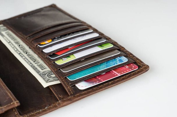Brown leather wallet with money, credit and discount cards - Photo, image