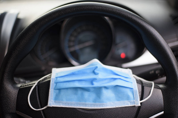 Surgical mask in car , Covid-19 protection concept  - Foto, Bild