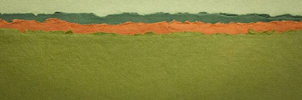 paisagem verde e laranja - uma coleção de papéis indianos coloridos feitos à mão produzidos a partir de tecido de algodão reciclado, bandeira web panorâmica
 - Foto, Imagem