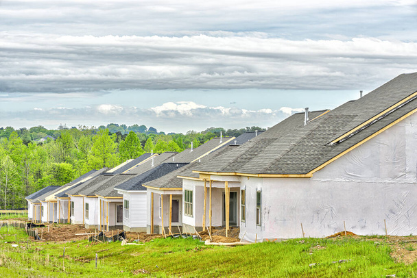 Horizontal shot of new homes under construction. - Photo, image