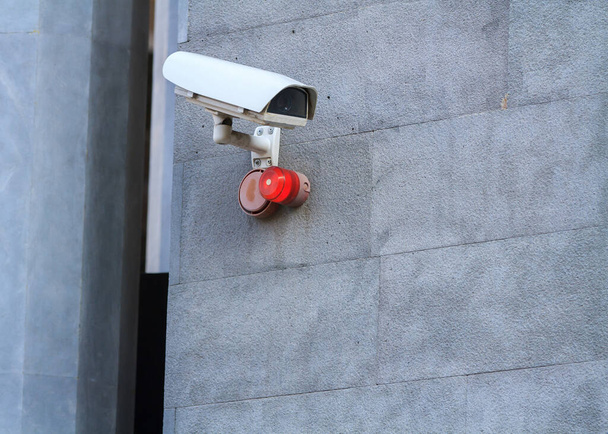 Camera attached to a wall of a building.  - Photo, Image