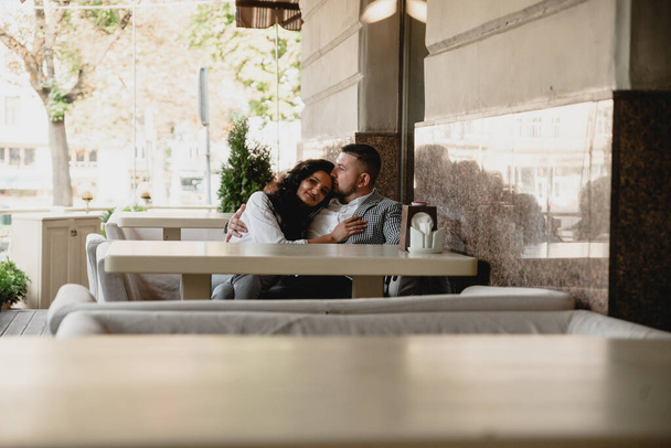 couple in love sitting in a cafe,lovers are sitting in an empty restaurant,life after quarantine,beautiful young couple - Fotografie, Obrázek