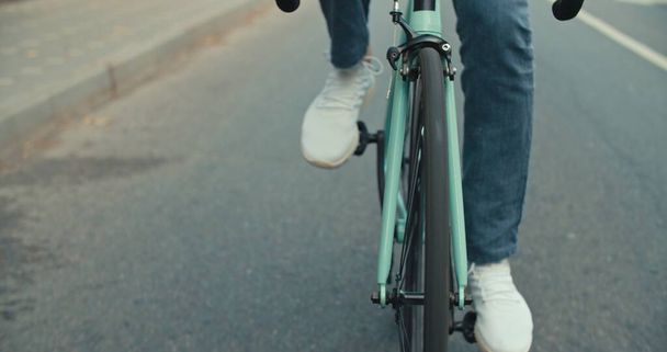 Young hipster man riding bike - 写真・画像