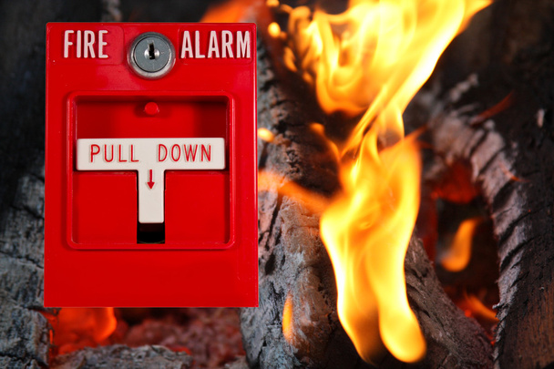 Alarma de incendio con fondo de fuego
 - Foto, imagen